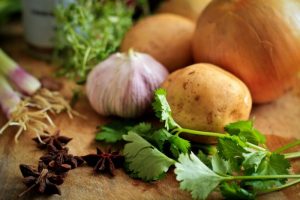 close up of onions, potatoes, cilantro